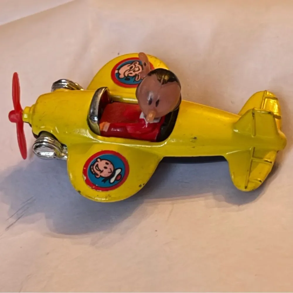 vintage 1980 Corgi Juniors Olive Oyl yellow airplane from the Popeye cartoon